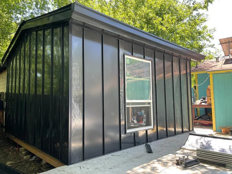 Black standing seam metal wall panels for Roof Inspection in Wahpeton