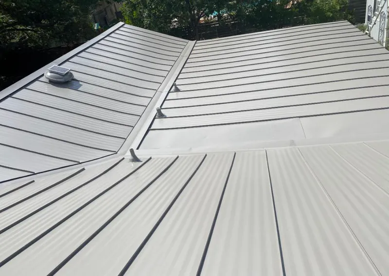 Solar attic fan installed on a metal roof for Roof Ventilation in Wahpeton